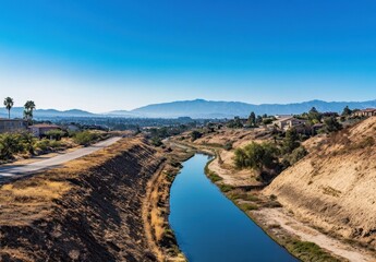 A tranquil river runs through a suburban town landscape