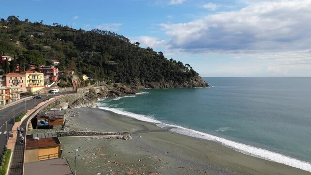 Europe, Italy, Liguria , Bonassola is a  sea village in province of Spezia in Gulf of Tigullio  , Drone  view of seafront with  pedestrian and cycle path through the tunnels from Levanto to Framura 