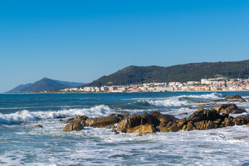 Coastal landscape of Vila Praia de Ancora. The waves break on the coast. Caminha - Viana do Castelo - Portugal