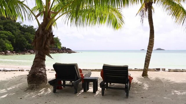 Tropical landscape view with deckchairs, Seychelles