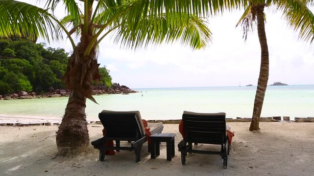 Tropical landscape view with deckchairs, Seychelles