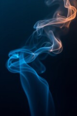 Obraz premium An abstract phone wallpaper showcasing swirling, ethereal smoke in deep blacks and electric blues with subtle gold accents, creating a mysterious and elegant atmosphere
