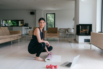 Young Beautiful Female Woman with Trainer via Video Call Conference in Bright Sunny House. Healthy...