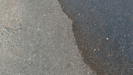 Textured Concrete Surface with Wet and Dry Areas Highlighting Visual Contrast