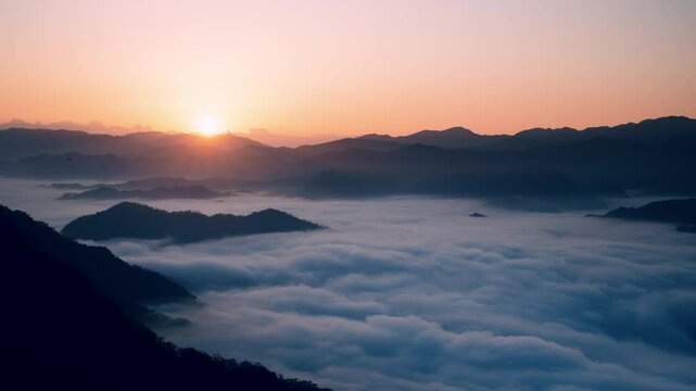 Captured in Xindian, New Taipei City, Taiwan, this image showcases a breathtaking sunrise over mist-covered mountains on a spring morning.