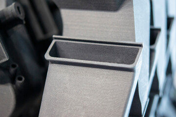 Plastic model printed on 3D printer from powder close-up. Objects created on 3D printer from...