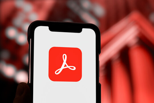 Guilherand-Granges, France - April 02, 2025. Adobe Acrobat enables creating, editing, signing, and managing PDF files across desktop, mobile, and web platforms with advanced features.