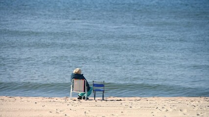 Solitary beach relaxation by ocean