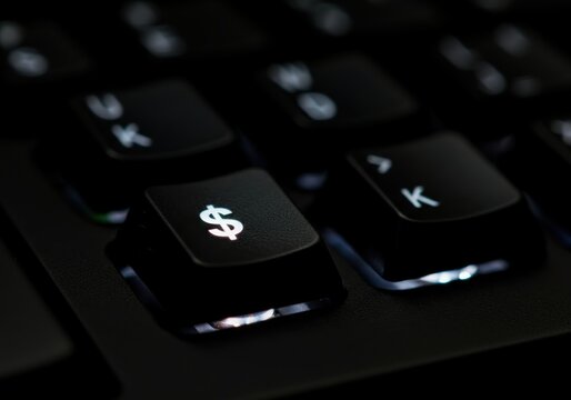 Close-up of a keyboard key featuring a dollar sign symbol - Powered by Adobe