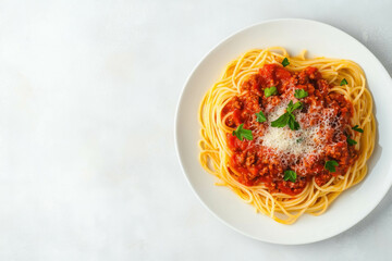 Delicious spaghetti bolognese with parmesan and parsley on white plate