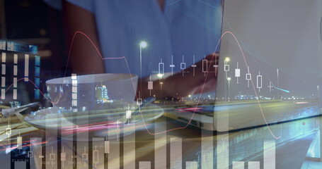 Image of statistics and data processing over businesswoman using laptop