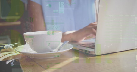 Image of statistics and data processing over businesswoman using laptop