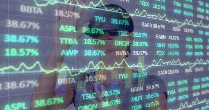 Image of financial data processing over businesswoman using vr headset