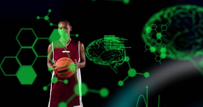 Image of digital brains and data processing over female basketball player holding ball - Powered by Adobe
