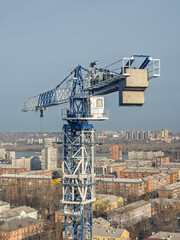 The upper part of the tower crane with the crane operator's cabin