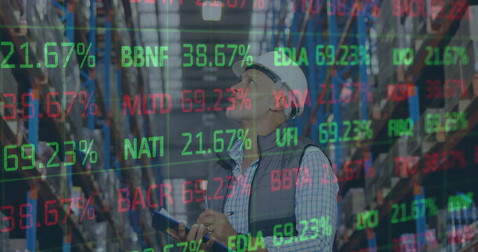 Image of financial data processing over man working in warehouse