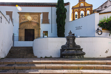 Ornate stone facade and fountain in cordoba, spain, showcasing andalusian heritage