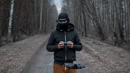 Military drone operator at war, preparing for flight, filming in forest