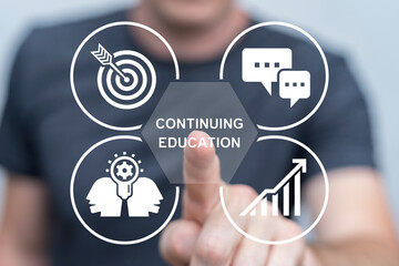 Person using virtual touch screen push inscription: CONTINUING EDUCATION. Continuing education and personal development concept. Continuing professional education.