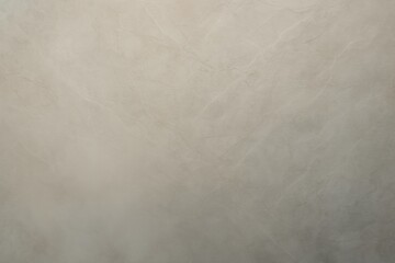 Naklejka premium Decorative plaster is covering a wall, creating a unique texture with subtle veins and patterns, suitable for backgrounds and design projects requiring a touch of elegance