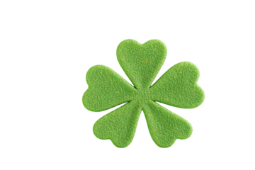Close up of a green four leaf clover on a black background in st patricks