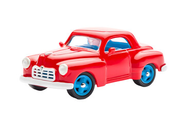 A bright red toy car with blue wheels on a black background studio shot