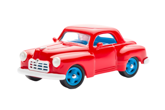 A bright red toy car with blue wheels on a black background studio shot