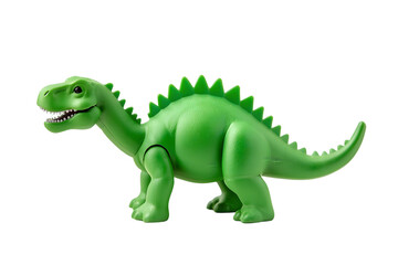 A green toy dinosaur with spikes on its back standing on black background