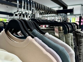Fototapeta premium Clothes on Hangers in Retail Store Display