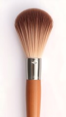 Powder Brush Close-up: An elegant close-up of a pristine powder brush, meticulously crafted with soft, natural bristles and a sleek handle, capturing the essence of beauty and makeup application.