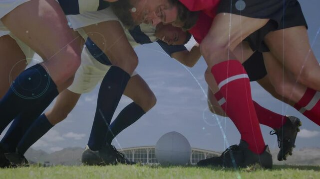 Rugby players in scrum formation over digital data processing animation