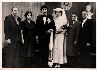 Chasov Yar, USSR - circa 1970: Vintage portrait of bride and groom and their parents in the...