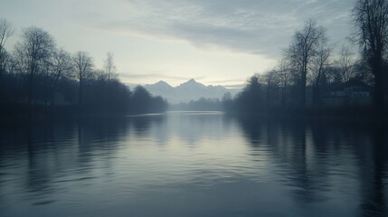 Misty river reflecting mountains