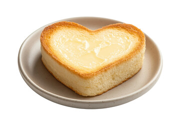 Heart-shaped bread on plate with butter spread, cut out