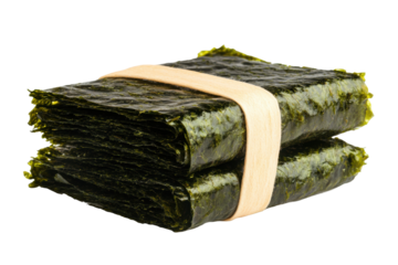 Stack of fresh seaweed sheets bound with natural twine on black background, cut out
