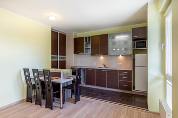 Modern Home Open Kitchen and Dining Area With Stylish Wooden Furniture