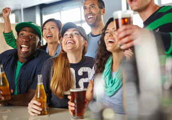 Pub, football and group of friends with beer watching sports match with happiness for winning goal. Supporters, alcohol and fans streaming broadcast television of soccer game for league in bar.