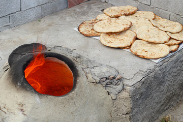 Baking bread in a tandoor oven using the traditional method in Hatay.