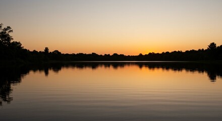 Serene Sunset over Calm Lake with Silhouetted Trees Peaceful Nature Scene