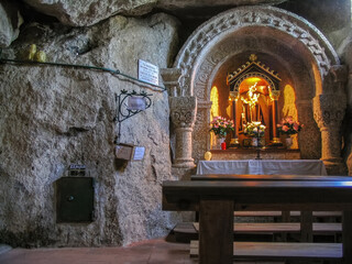 Guimaraes, Portugal. Our Lady of Lourdes Cave with Our Lady statue in altar. 19th Century Catholic Marian shrine in Penha Mount.