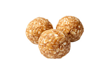 Three peanut candy balls with crunchy texture on black background, cut out