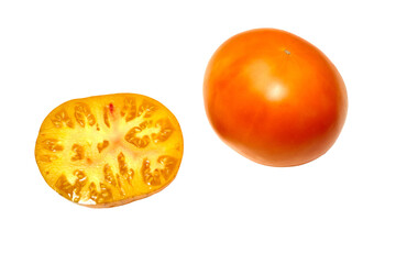 Yellow, orange tomato whole and cut in half, on white background. Fresh and ripe. Top view