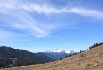 Scenic Mountain Range View with Blue Sky Rolling Hills and Cirrus Clouds