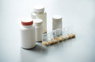 Sorted pills magnesium, zinc, vitamin B2 in container. Closeup of medical pill box with doses of...