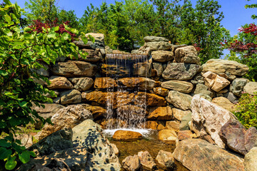 Beautiful decorative waterfall in a public park