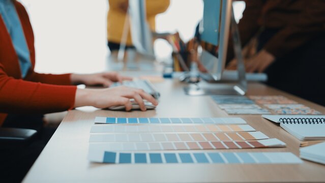 A dynamic creative workspace featuring color palettes and design tools, illustrating the collaborative process in interior design and artistic projects. SACTR