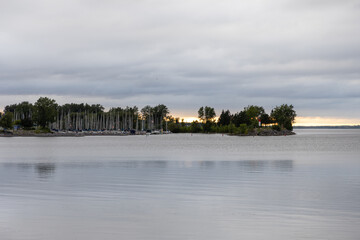 Sailing club with boats on the river during sunset in Ottawa, Canada.