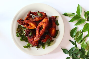 Vietnam pearl spot fish marinated with aromatic spices and fried to golden perfection