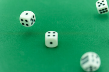 Rolling dice on a green felt surface creates excitement in a gam