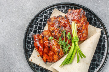 hot grilled spare ribs glazed in BBQ sauce. Food recipe background. Close up. top view